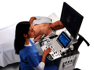 A doctor is performing a cardiac ultrasound exam