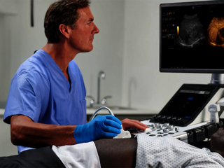 A doctor is conducting an abdominal ultrasound exam