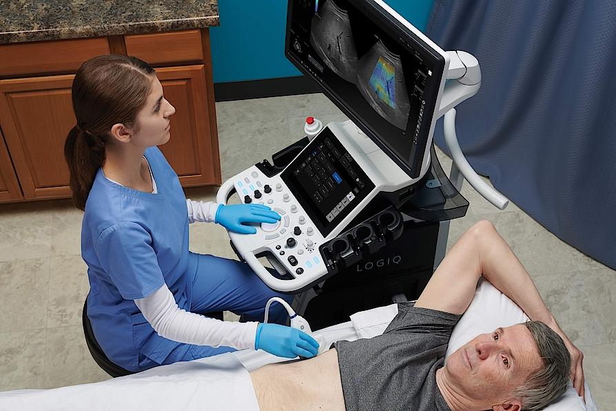 Doctor performing an ultrasound exam on a patient's liver.