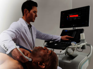 A doctor is conducting an ultrasound exam of a patient's thyroid