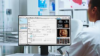 A doctor is doing his ultrasound reporting with ViewPoint 6 software